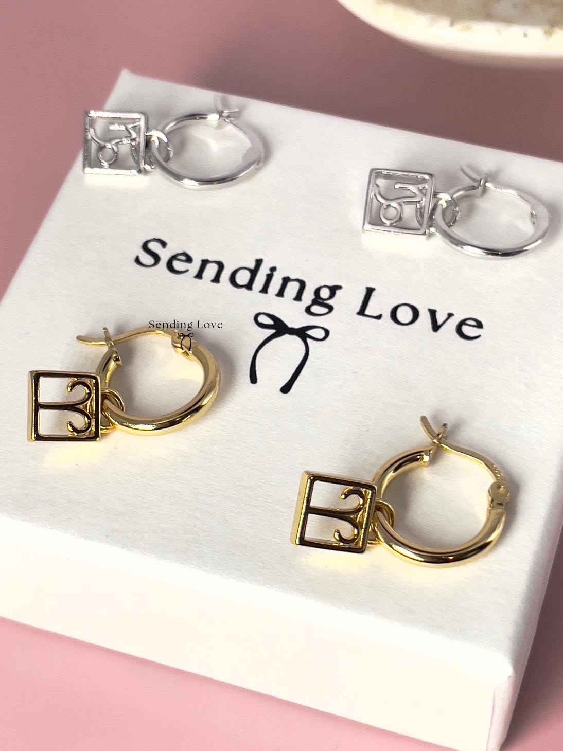 Zodiac Hoop Earrings: Sterling Silver Star Sign Charm